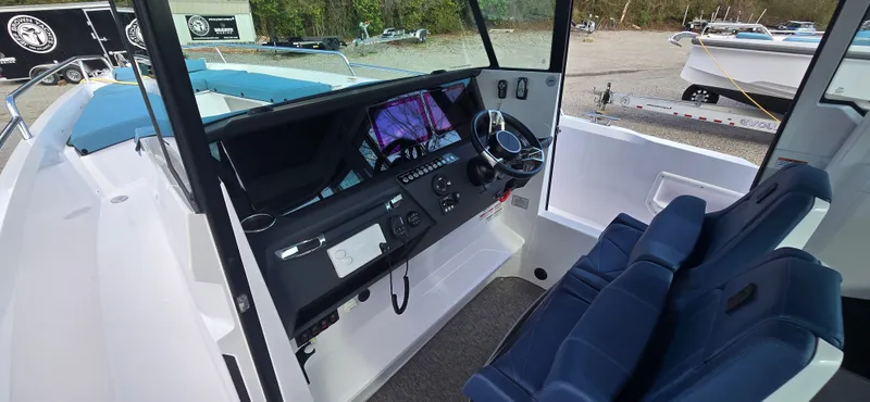 Slide: The Image of Interior view of 2024 Axopar 29 boat with modern helm console. - 11