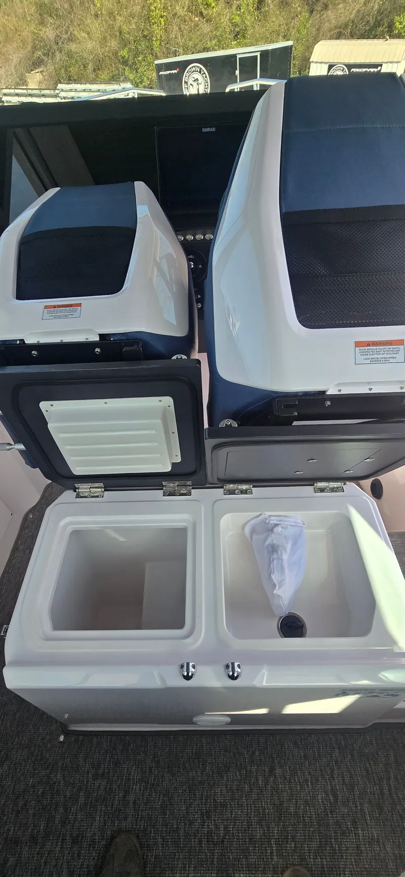 Slide: The Image of 2024 Axopar 29 boat interior with storage compartments. - 17