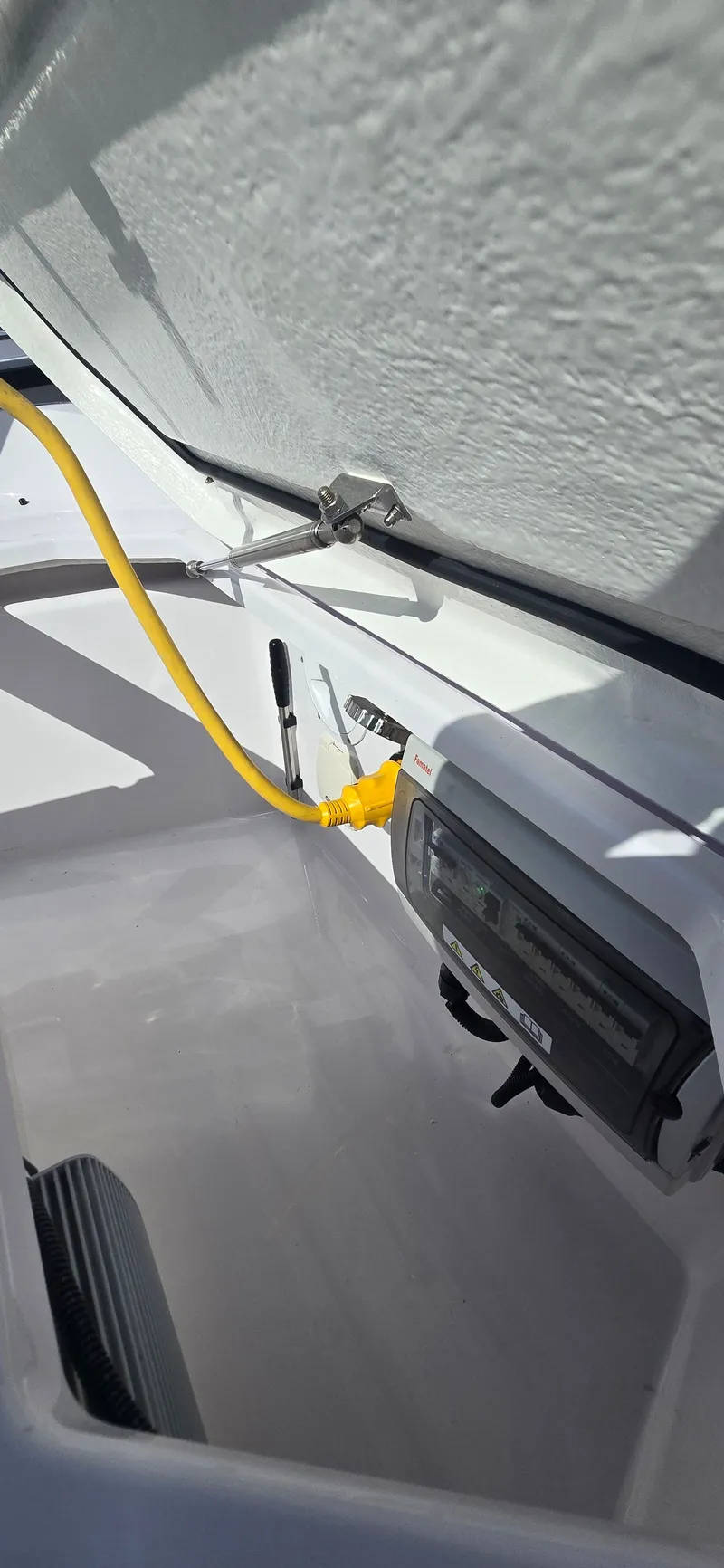 Slide: The Image of 2024 Axopar 29 boat interior with yellow cable. - 21