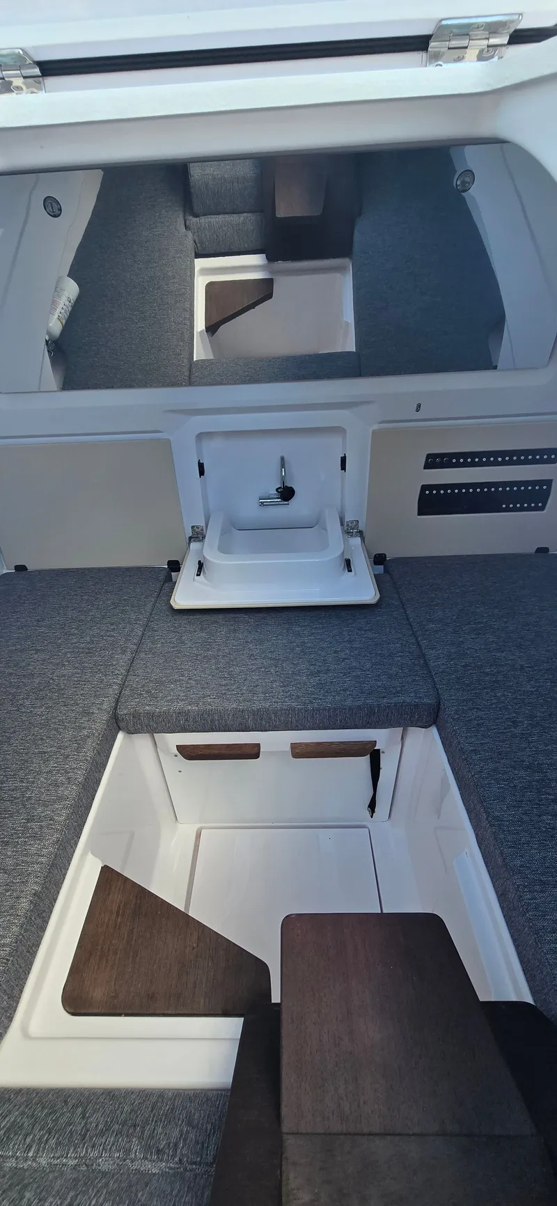 Slide: The Image of Interior of 2024 Axopar 29 boat with sink and seating area. - 24