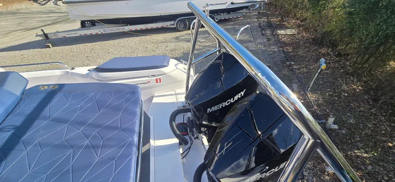 Slide: The Image of 2024 Axopar 29 with Mercury engines, luxurious upholstery, parked outdoors. - 4