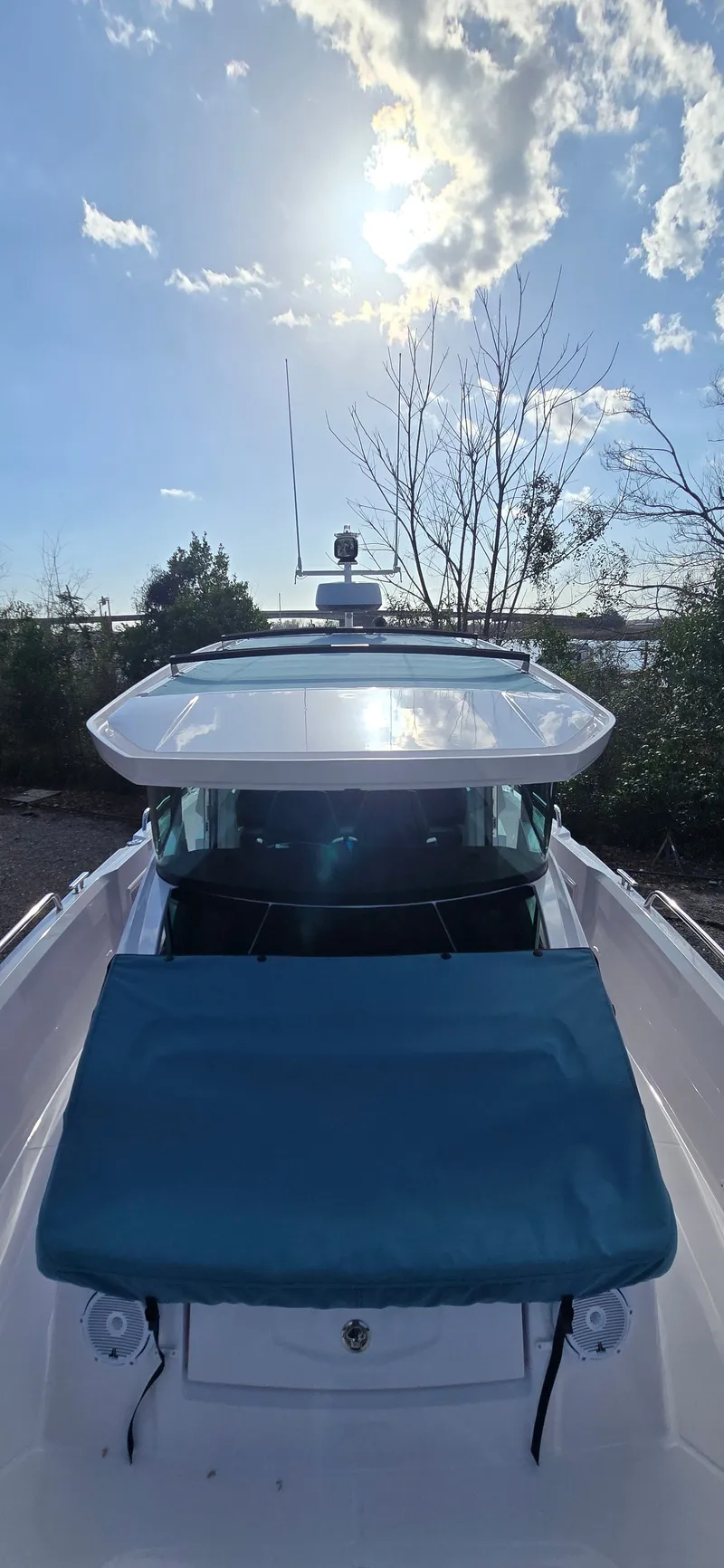 Slide: The Image of Axopar 29 boat 2024 under sunny sky. - 8