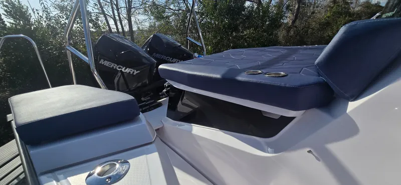 Slide: The Image of 2024 Axopar 29 boat with Mercury engines, luxurious outdoor seating. - 9