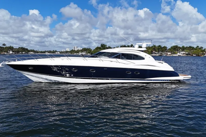The Image of Luxury Sunseeker Predator 56 yacht from 2000 on calm water under a blue sky. - 0