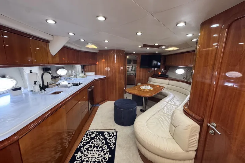 Slide: The Image of Luxurious interior of 2000 Sunseeker Predator 56 yacht with elegant wood finishes. - 14