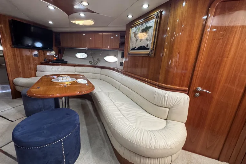 Slide: The Image of Luxurious interior of 2000 Sunseeker Predator 56 yacht with elegant seating and wooden finishes. - 15