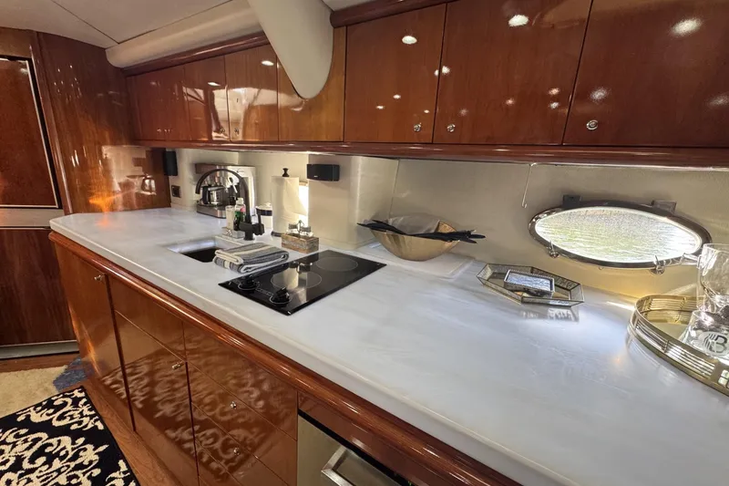 Slide: The Image of Luxurious Sunseeker Predator 56 yacht kitchen with sleek countertops and modern appliances, 2000 model. - 18