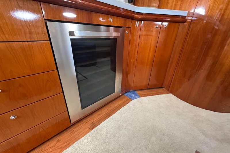 Slide: The Image of Luxurious wooden interior of 2000 Sunseeker Predator 56 yacht with modern stainless steel appliance. - 19