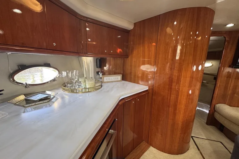 Slide: The Image of Luxurious interior of 2000 Sunseeker Predator 56 yacht with polished wood and elegant decor. - 20