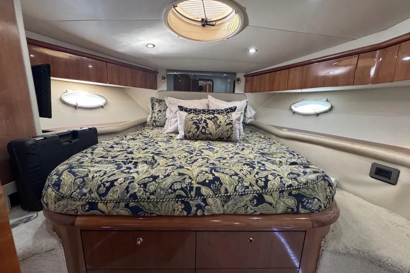 Slide: The Image of Luxurious cabin interior of a 2000 Sunseeker Predator 56 yacht with elegant bedding. - 22