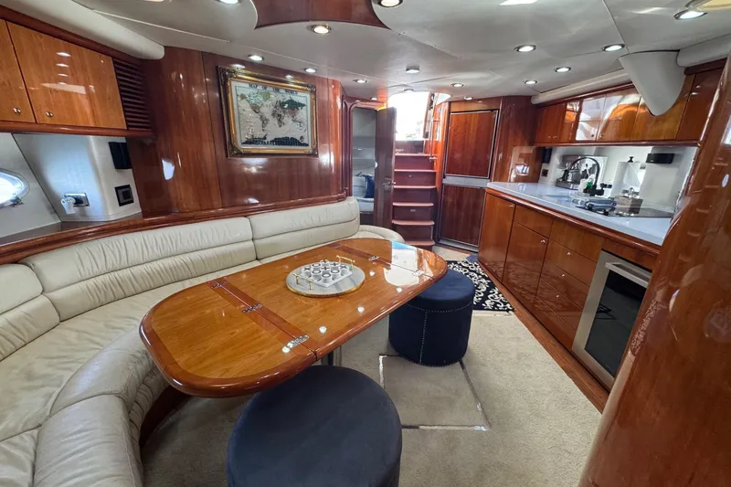 Slide: The Image of Luxurious interior of a 2000 Sunseeker Predator 56 yacht with elegant wood finishes. - 23