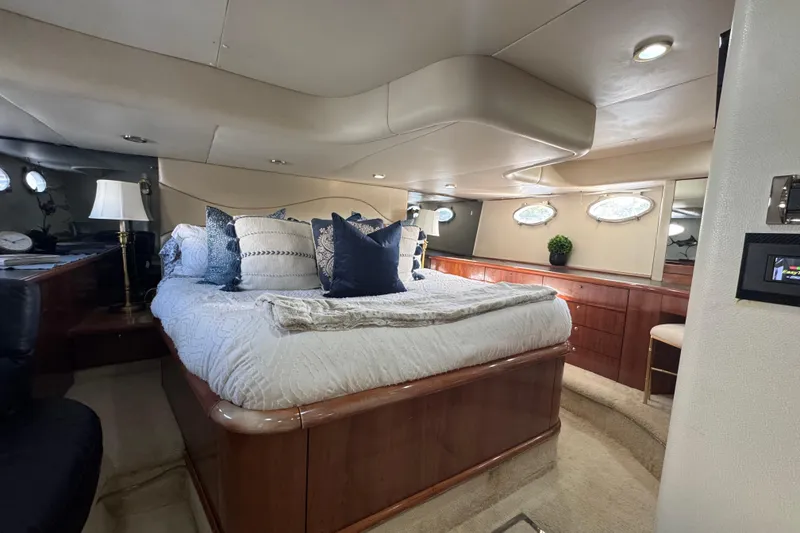 Slide: The Image of Luxurious bedroom interior of 2000 Sunseeker Predator 56 yacht with elegant decor. - 25