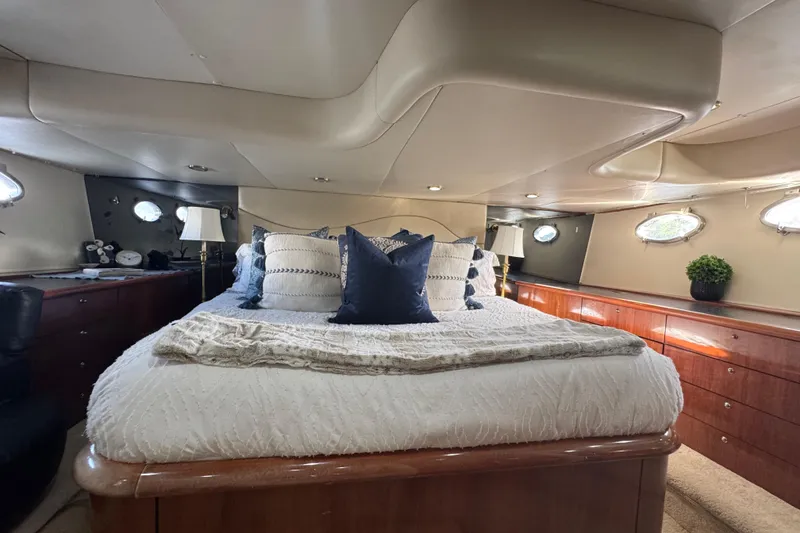 Slide: The Image of Luxurious bedroom interior of 2000 Sunseeker Predator 56 yacht with elegant bedding and decor. - 26