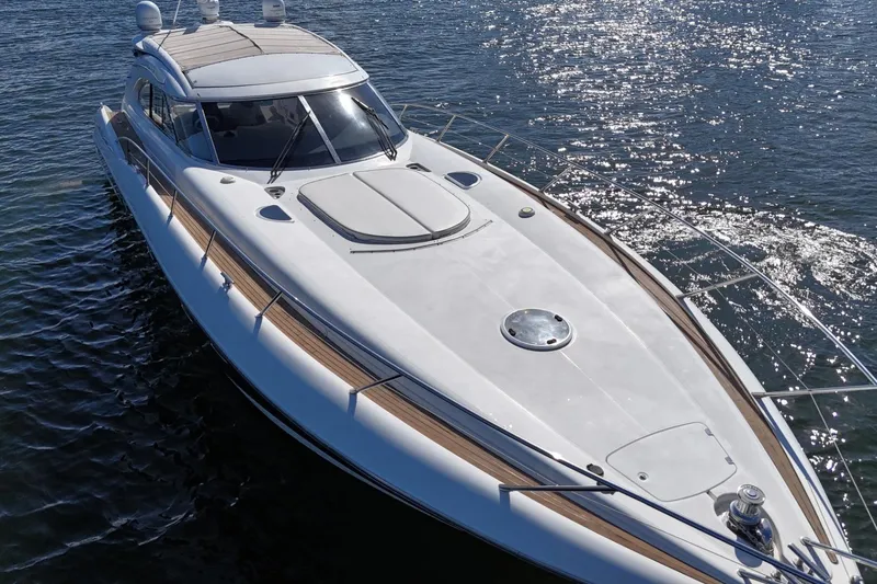 Slide: The Image of Sunseeker Predator 56 yacht from 2000 on sparkling water, showcasing sleek design and luxury. - 3