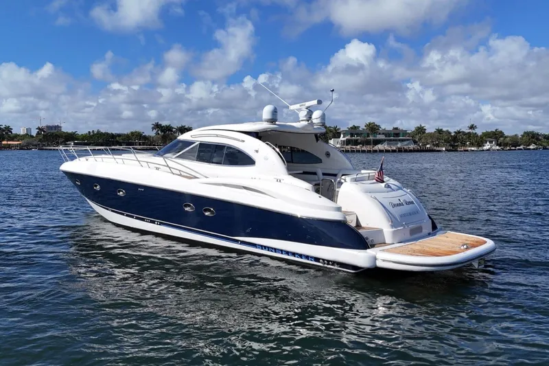 Slide: The Image of 2000 Sunseeker Predator 56 yacht on water, clear sky, luxury vessel. - 6