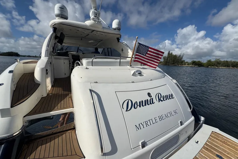 Slide: The Image of Sunseeker Predator 56 yacht, 2000 model, docked with American flag, Myrtle Beach, SC. - 9