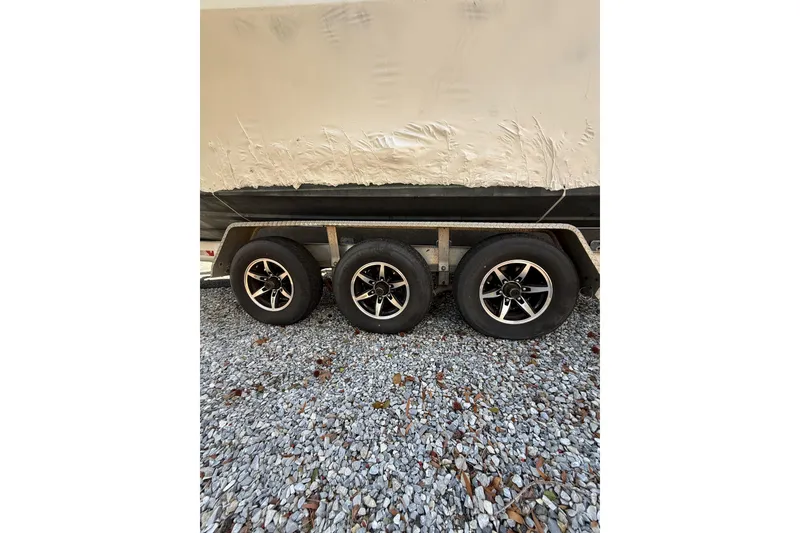 Slide: The Image of Trailer with three wheels for 2015 Regulator 28 Forward Seating boat. - 13