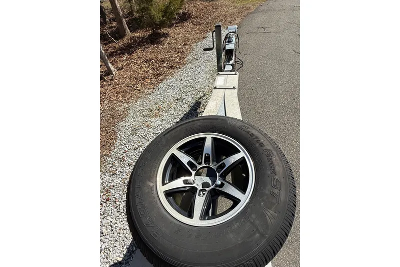 Slide: The Image of Trailer with spare tire for 2015 Regulator 28 Forward Seating boat. - 14