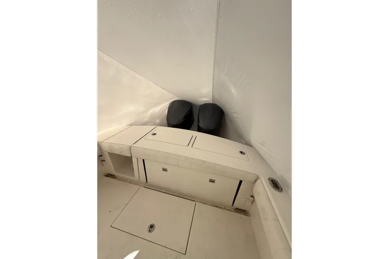 Slide: The Image of 2015 Regulator 28 Forward Seating boat interior with storage compartments. - 37