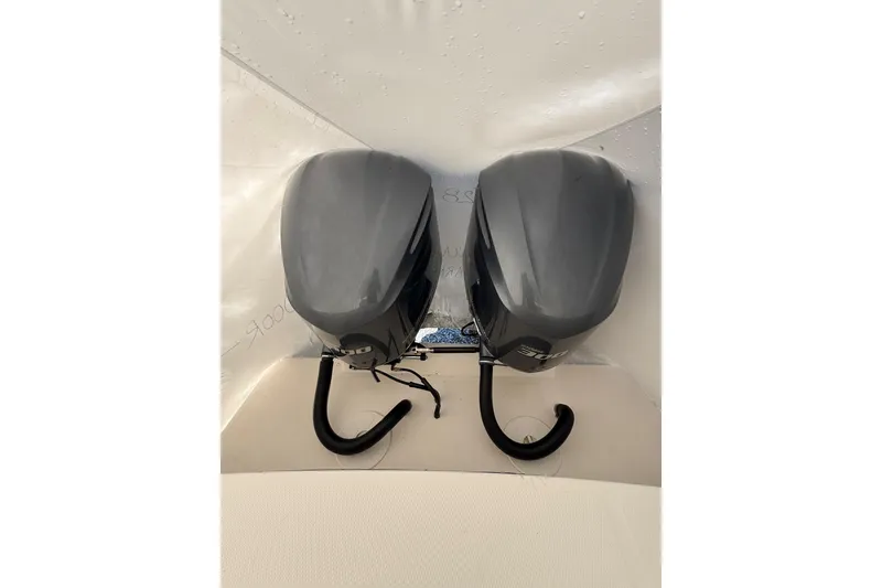 Slide: The Image of 2015 Regulator 28 Forward Seating boat with dual outboard motors. - 39