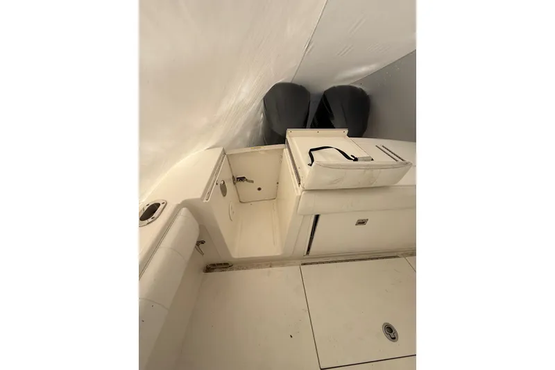Slide: The Image of 2015 Regulator 28 Forward Seating boat interior with dual engines and storage compartments. - 42