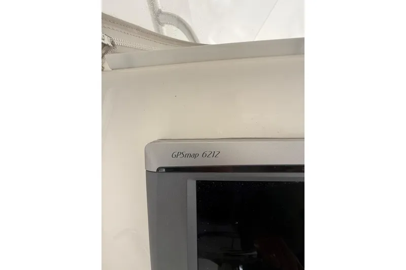 Slide: The Image of GPSmap 6212 device on 2015 Regulator 28 Forward Seating boat dashboard. - 54