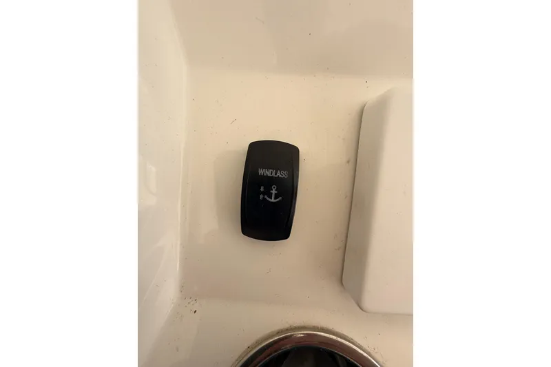 Slide: The Image of Windlass switch on 2015 Regulator 28 Forward Seating boat dashboard. - 59
