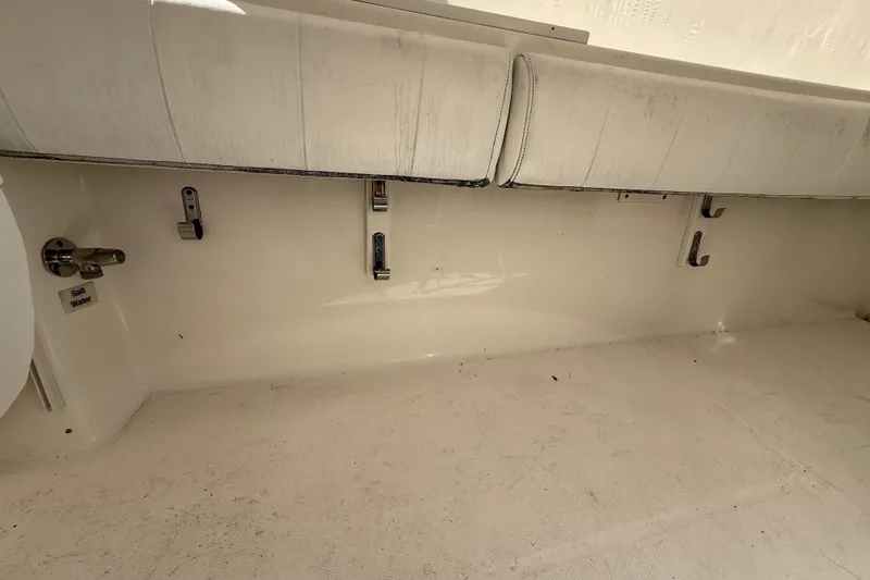 Slide: The Image of 2015 Regulator 28 Forward Seating interior with saltwater washdown and storage hooks. - 61