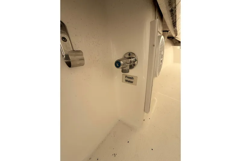 Slide: The Image of Fresh water outlet on 2015 Regulator 28 Forward Seating boat. - 63