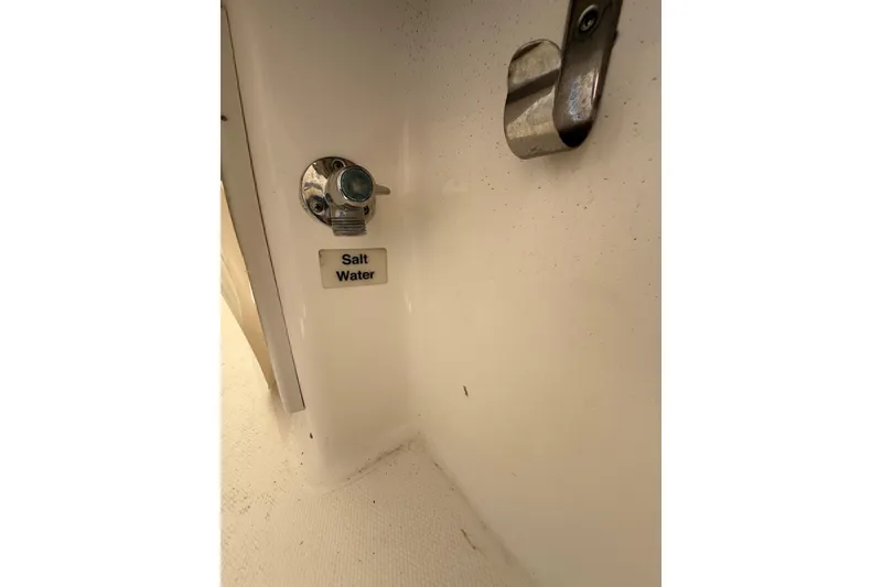 Slide: The Image of 2015 Regulator 28 Forward Seating salt water outlet detail. - 64