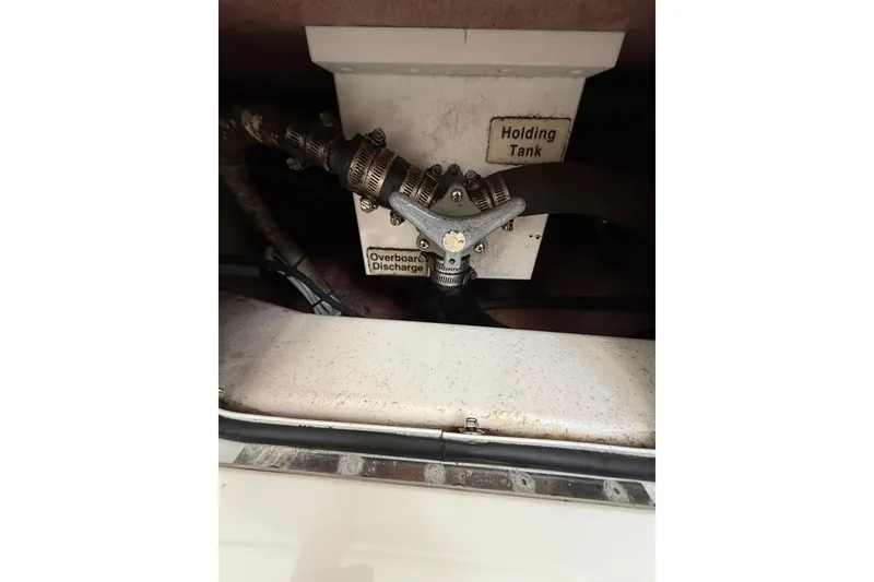 Slide: The Image of 2015 Regulator 28 Forward Seating boat holding tank and overboard discharge system. - 74