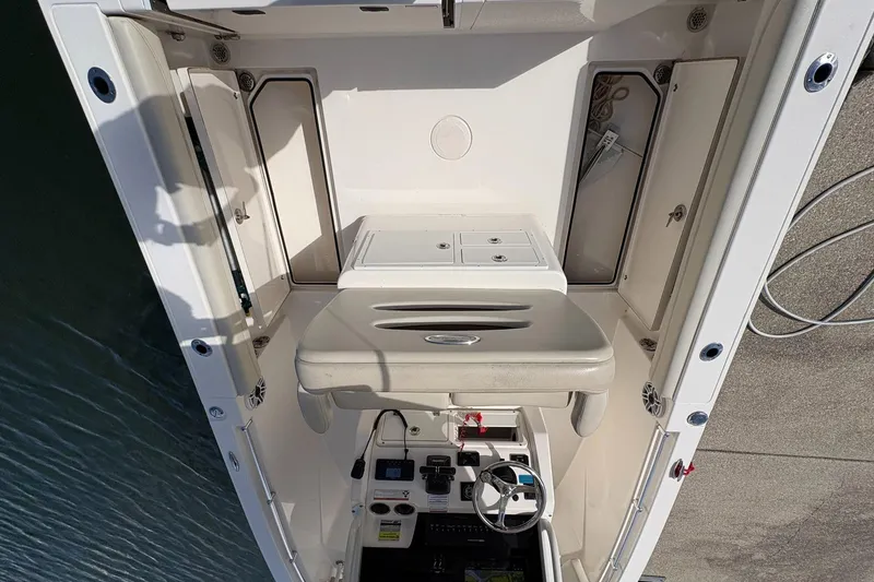 Slide: The Image of 2020 Cobia 240 Center Console boat interior with helm and seating area. - 14