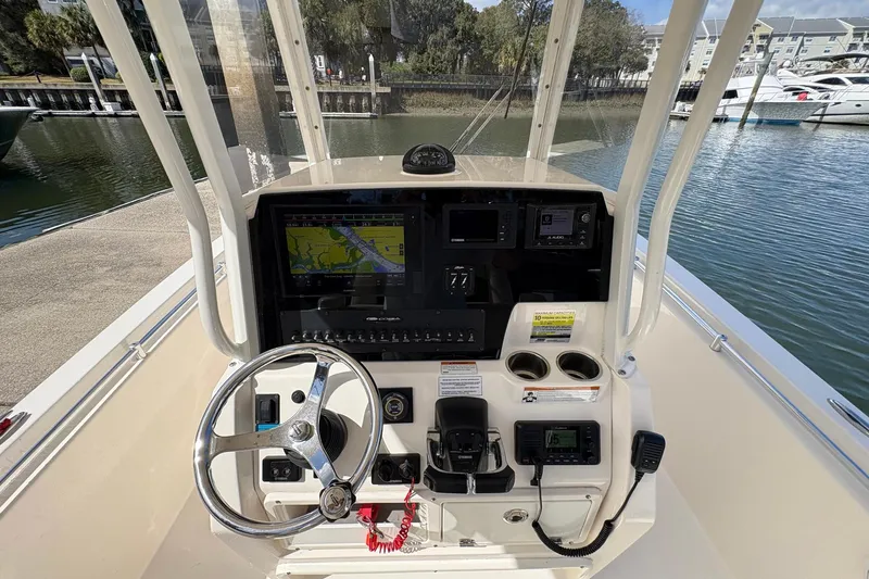 Slide: The Image of 2020 Cobia 240 Center Console boat dashboard with navigation and control systems. - 21