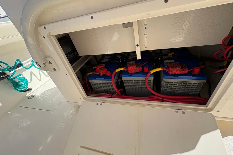 Slide: The Image of 2020 Cobia 240 Center Console boat battery compartment with wiring. - 25