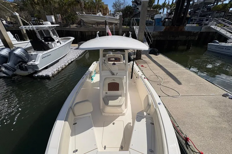 Slide: The Image of 2020 Cobia 240 Center Console boat docked at marina, top view. - 26