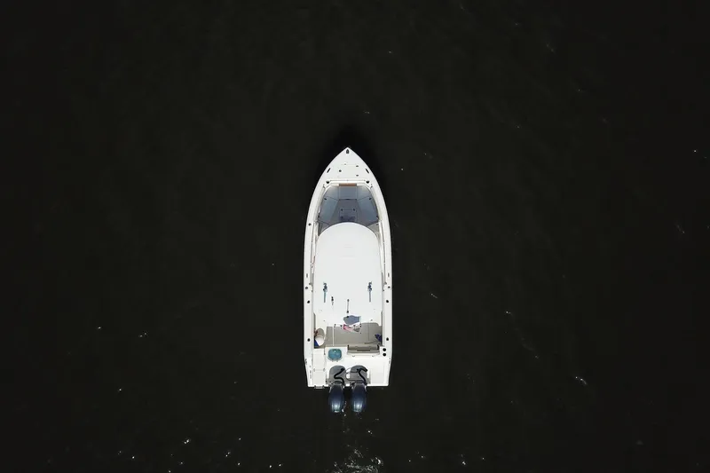 Slide: The Image of Aerial view of 2020 Cobia 240 Center Console boat on dark water. - 7