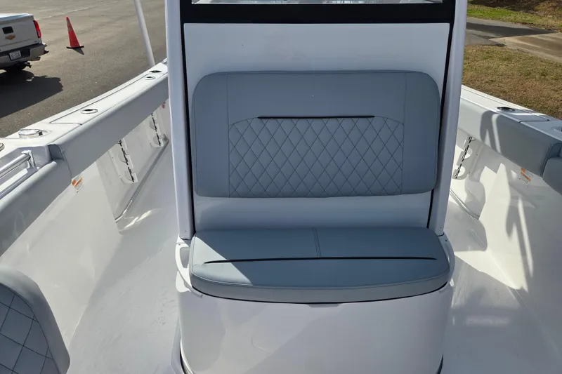 Slide: The Image of 2026 Sportsman Open 212 Center Console boat with cushioned seating and sleek design. - 12