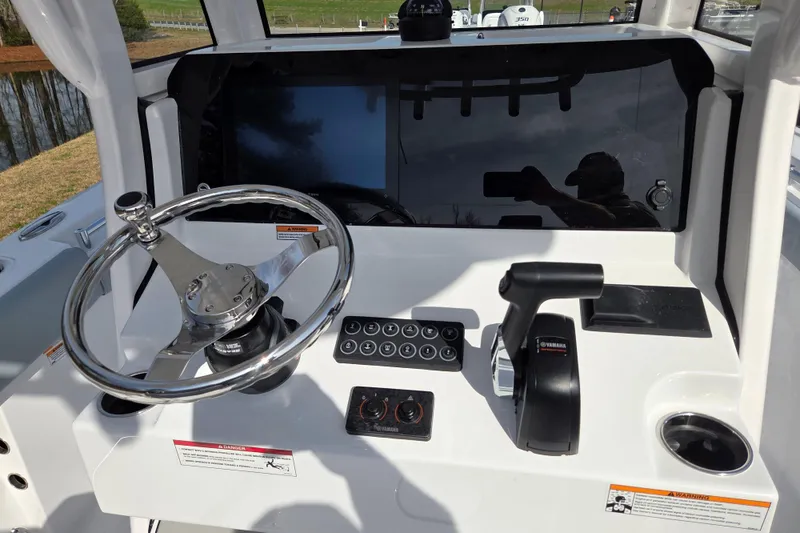 Slide: The Image of 2026 Sportsman Open 212 Center Console dashboard with steering wheel and controls. - 13