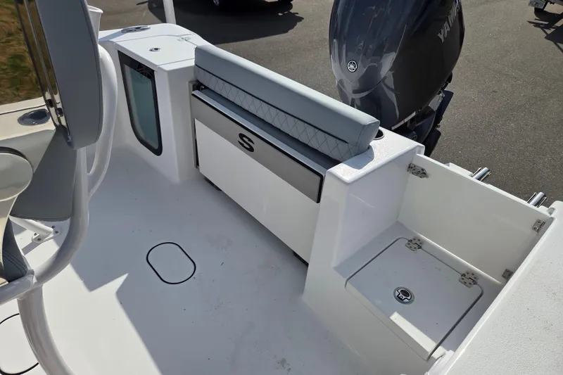 Slide: The Image of 2026 Sportsman Open 212 Center Console boat interior with seating and storage compartments. - 17