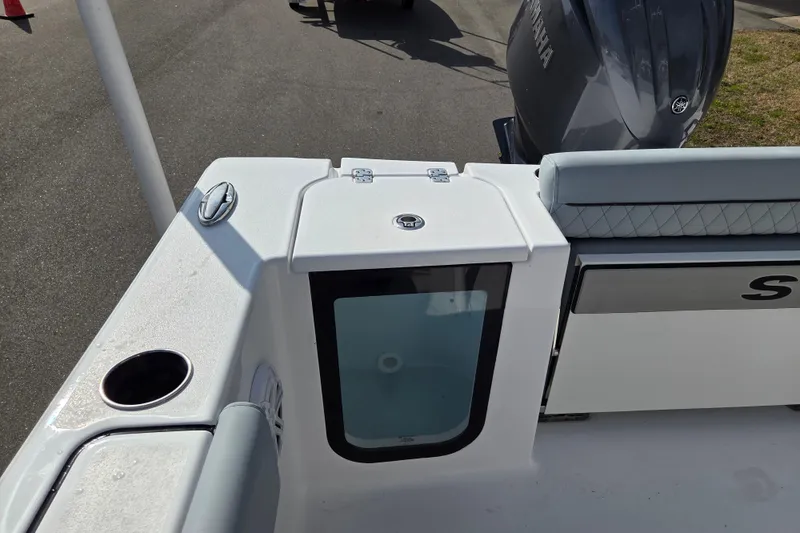 Slide: The Image of 2026 Sportsman Open 212 Center Console boat with Yamaha engine, featuring sleek design and storage. - 18
