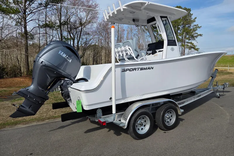 Slide: The Image of 2026 Sportsman Open 212 Center Console boat on trailer with Yamaha outboard motor. - 2