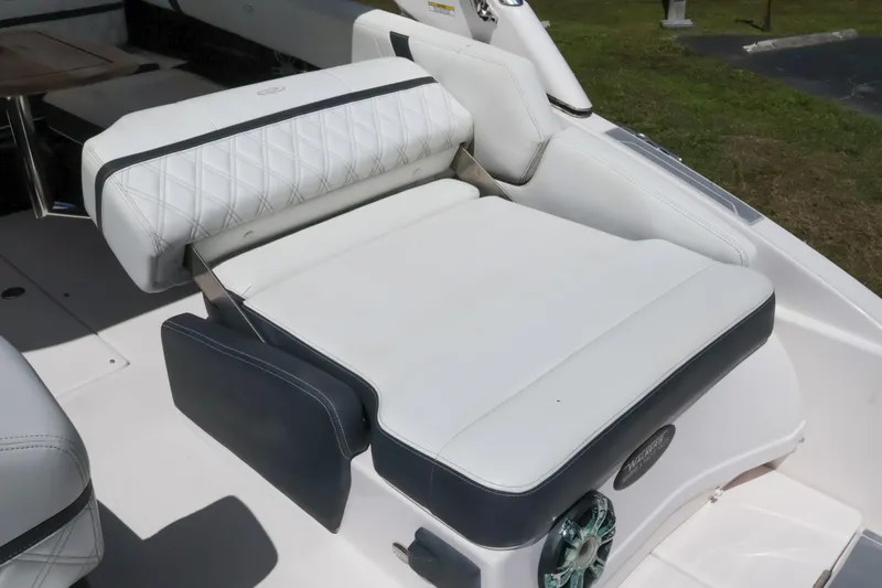 Slide: The Image of 2019 Regal 29 OBX boat interior with white cushioned seating and elegant design. - 18