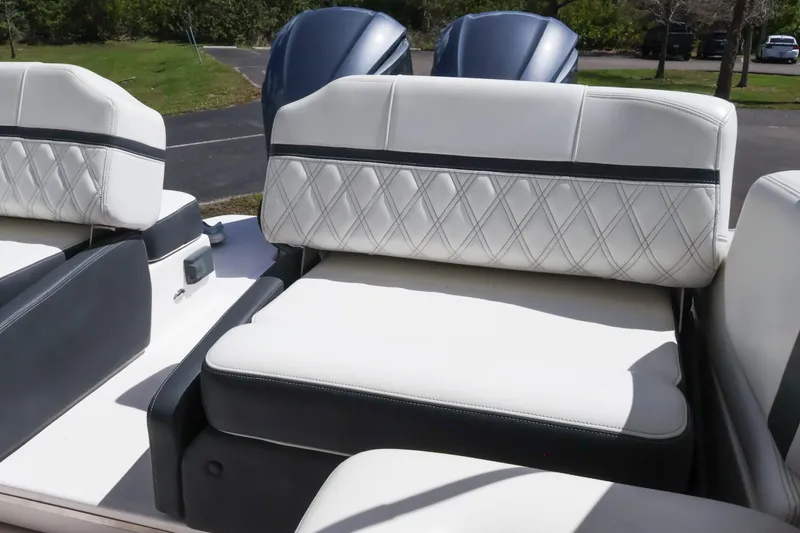 Slide: The Image of 2019 Regal 29 OBX boat interior with white diamond-stitched seating. - 19