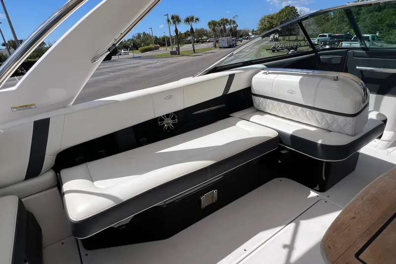 Slide: The Image of 2019 Regal 29 OBX boat interior with white seating and sleek design. - 20