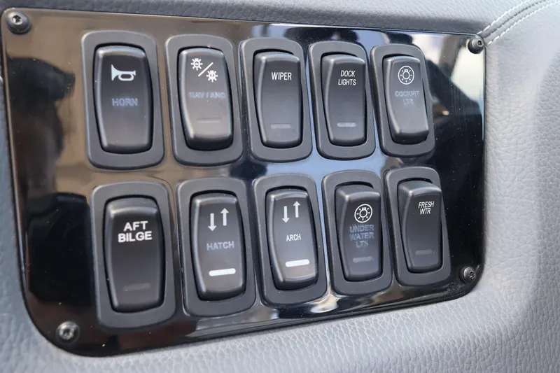 Slide: The Image of Control panel of a 2019 Regal 29 OBX boat with various switches. - 30