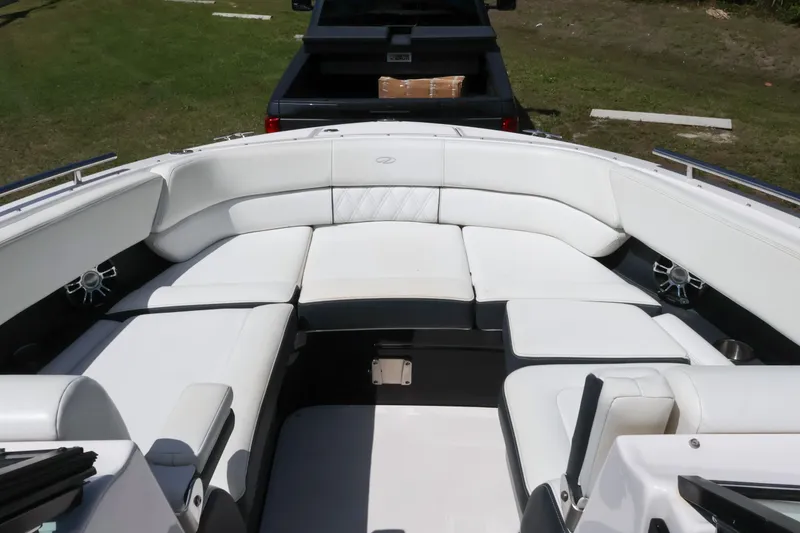 Slide: The Image of 2019 Regal 29 OBX boat interior with white seating and speakers. - 36