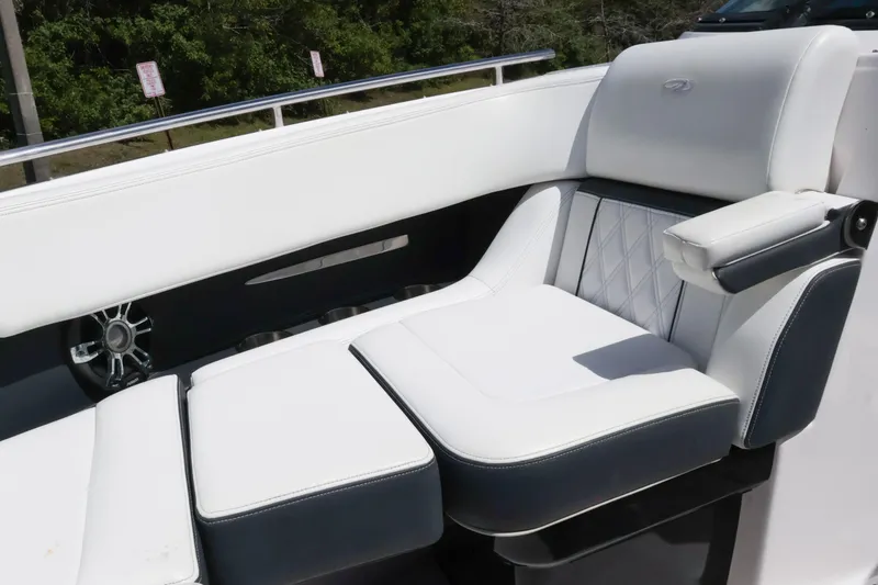 Slide: The Image of 2019 Regal 29 OBX boat interior with luxurious white seating and armrest. - 37