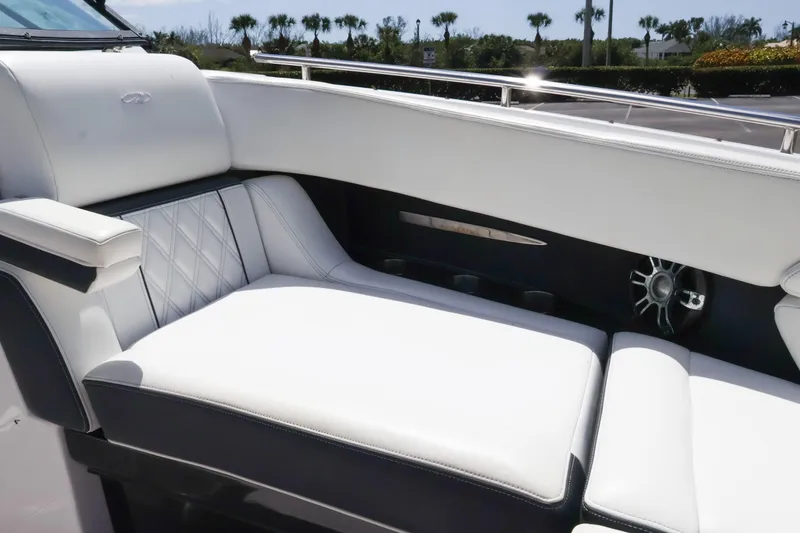 Slide: The Image of Luxurious seating on 2019 Regal 29 OBX boat with white upholstery and elegant design. - 38