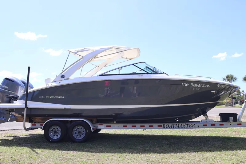 Slide: The Image of 2019 Regal 29 OBX boat on trailer, side view, with Yamaha engines. - 4