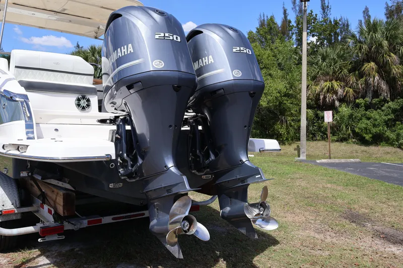 Slide: The Image of 2019 Regal 29 OBX boat with twin Yamaha 250 outboard engines, parked on a trailer. - 6
